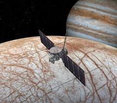 Satellite looking spacecraft over europa, infront of jupiter